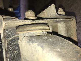 Rear end bush of left lower control arm