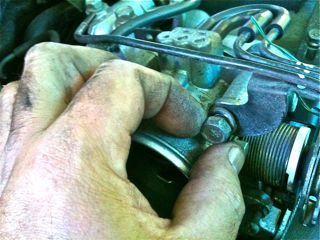 Normally 5x bolts holding the housing in place (4x in front &amp; 1x on side bracket)