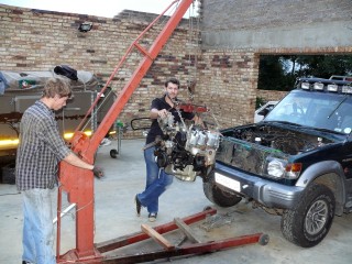 Younger two sons helping with replacing the engine