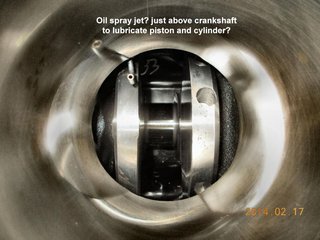 Oil nozzle below cylinder