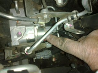 The sticker with pump number is next the valve.