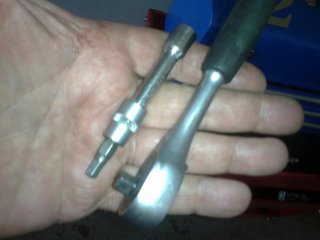 You need a small ratchet extension and 5 mm allen key socket