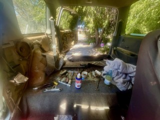 Front seat removed to fix seat attachments.