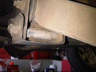 Arm bolt hanging free with wheel off, could get whoel finger in there