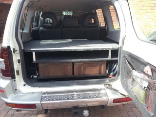 Showing drawer system in stowed position and water tank outlet bottom right