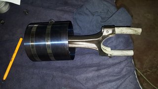 Rings on piston with ring squeezer